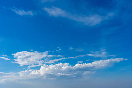 Beautiful white clouds floating on the blue skyの写真素材