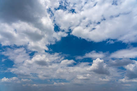 White clouds in the summer blue sky backgroundの写真素材