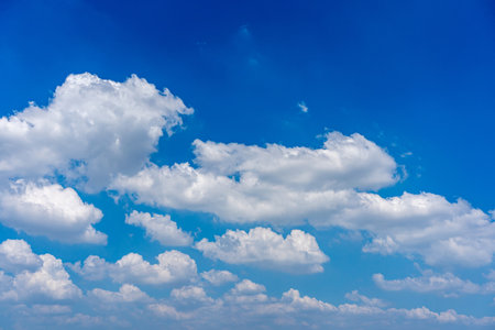 White clouds with cotton texture on the blue sky backgroundの写真素材