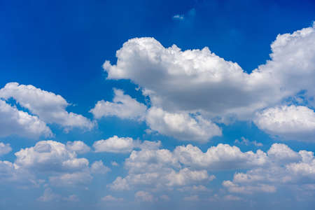 White cumulus clouds on the blue sky backgroundの写真素材
