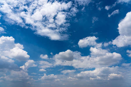 Blue sky background with white clouds floatingの写真素材