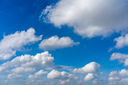 Beautiful blue sky with white cumulus clouds floatingの写真素材
