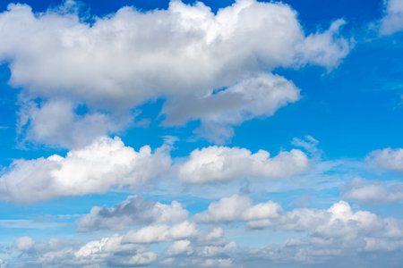 Beautiful blue sky with many white clouds floatingの写真素材
