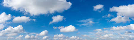 Panoramic photo of white clouds in the blue sky backgroundの写真素材