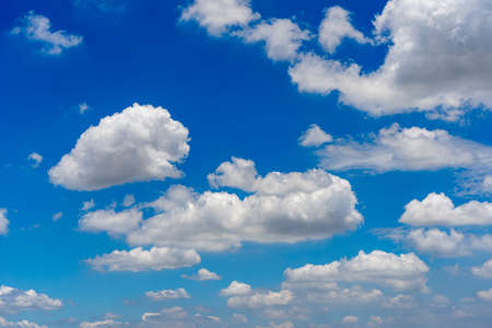 Amazing blue sky background with many white clouds floatingの写真素材