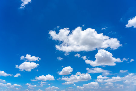 Beautiful blue sky with white cumulus clouds floatingの写真素材