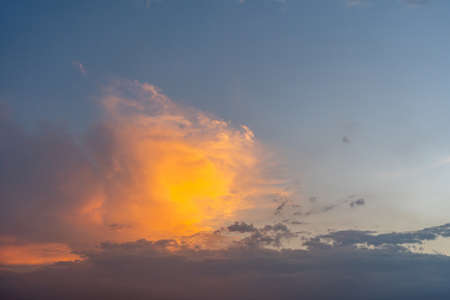 Beautiful orange cloud in the sunset sky backgroundの写真素材