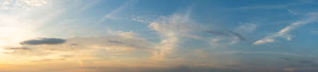 Panorama photo of sunset cloudy sky backgroundの写真素材