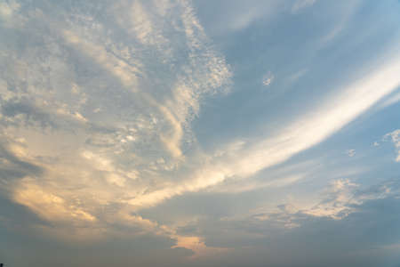 Beautiful clouds on blue sky and orange sunsetの写真素材