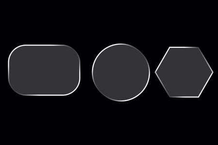 A clean minimalist design featuring a rounded rectangle, circle, and hexagon outlined in white on a dark background. Perfect for modern graphic design, logo creation, and abstractの写真素材