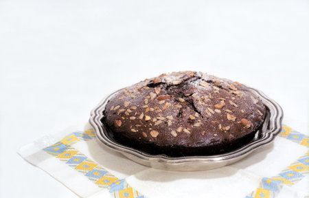 Chocolate cake with nuts on the plate 