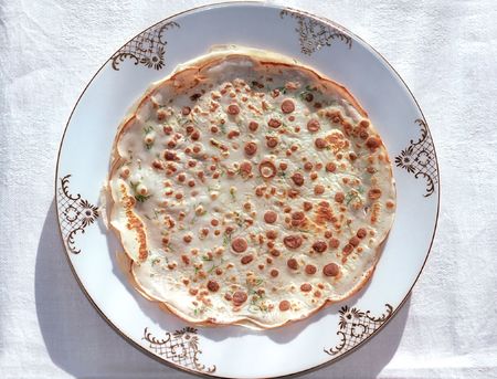 Pancake with herbs on the plateの写真素材
