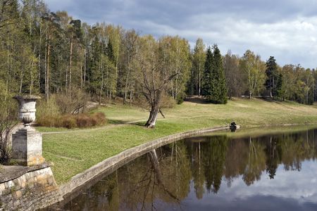View of spring park with classical vaseの写真素材