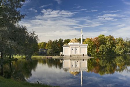 Autumn landscape with mosque near pond in the beautiful parkの写真素材