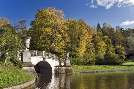 Classical bridge in the autumn parkの写真素材