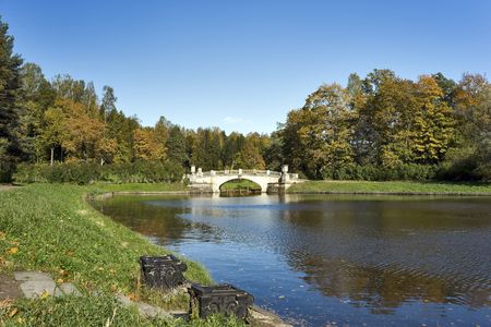 Classical bridge and an ancient pier in the autumn parkの写真素材