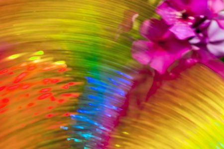 Multicolored blur background of rotating strips and flowersの写真素材