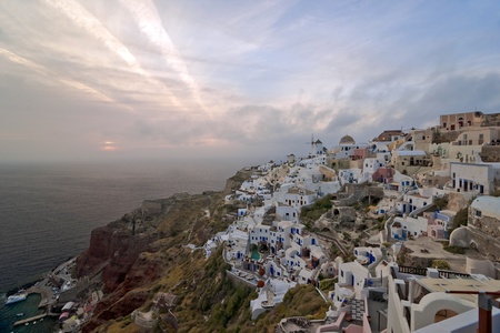 Santorini sundown to clouds in Ia village の写真素材