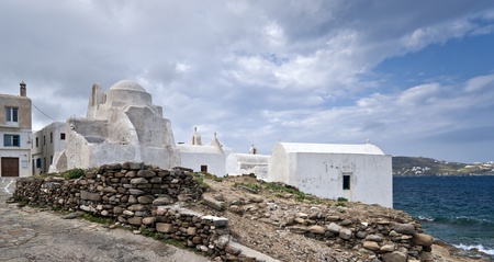 White churches next to the seaの写真素材