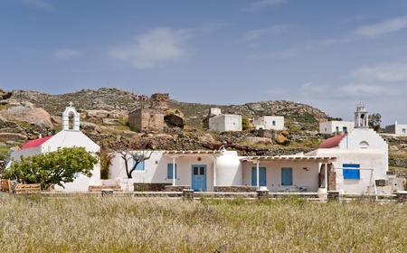 Red roof churches and houses next to the ruined building in Mykonos islandのeditorial素材