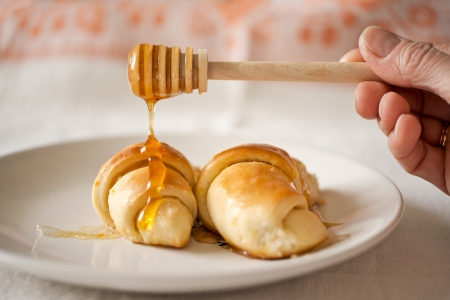 Sweet buns topping off with honeyの写真素材