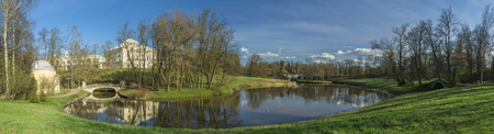 Classical palace view with river and bridge in beautiful spring park, panoramaのeditorial素材