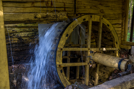 Working watermill wheel with falling water in the village in Voronezh Regionの写真素材