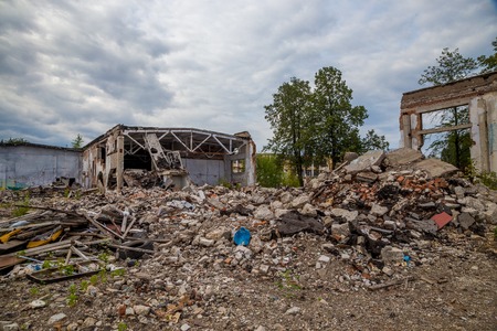 Pile of debris of a destroyed building. Pieces of Metal and Stone are Crumbling from Demolishedの写真素材