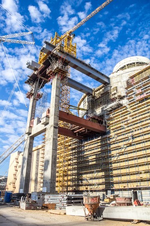 Building of new nuclear power plant. Crane is workingの写真素材
