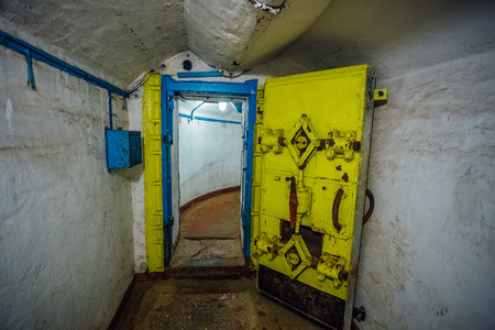Yellow hermetic metal armored door, entrance of soviet military bunkerの写真素材