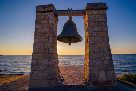 Famous Hersones bell on the Black sea coast at sunset, Sevastopol, Crimeaの写真素材