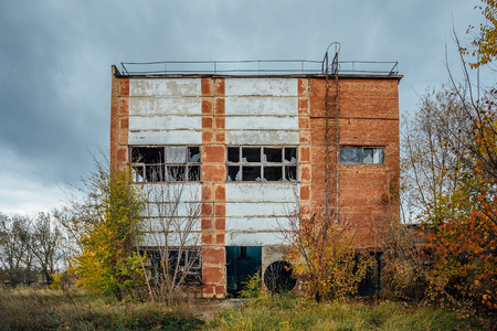 Old obsolete ruined concrete industrial building. Abandoned factory.  Concrete ruins in industrial districtの写真素材