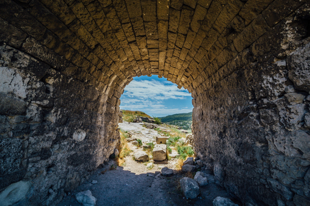 Old archway tunnel through old fortification wall.の写真素材