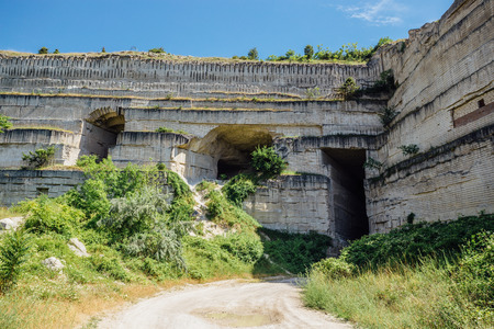 Tunnel through the mountain at limestone mine.の写真素材