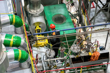 Mechanical engineer rotates control valve and adjusting compressor system.