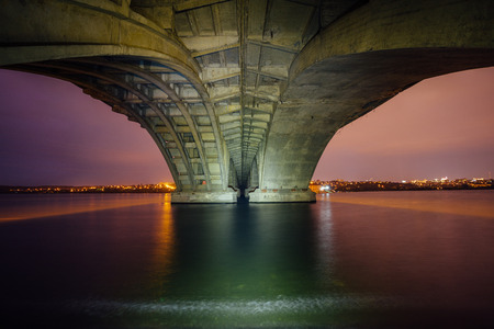 Under Vogresovsky Bridge through Voronezh river at night.の写真素材