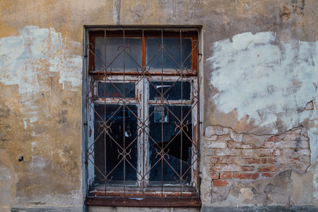 Broken window glass. Rotten frames. Abandoned building.