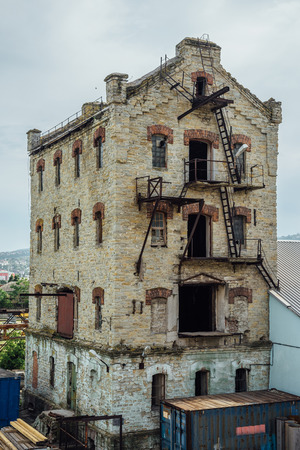 Abandoned brick industrial building Former elevator of factory of baked goods, Novorossiysk, Russia.の写真素材