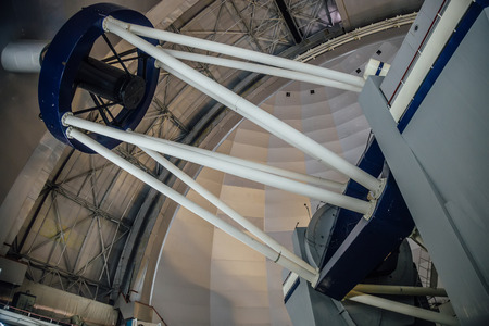 Huge modern professional astrophysical telescope under dome of observatory.の写真素材