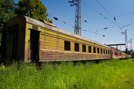 Abandoned train. Forgotten overgrown railway. Old rusty railway carriage.の写真素材