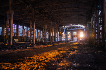 Sunlight of sunset in large abandoned industrial building of Voronezh excavator factory.の写真素材
