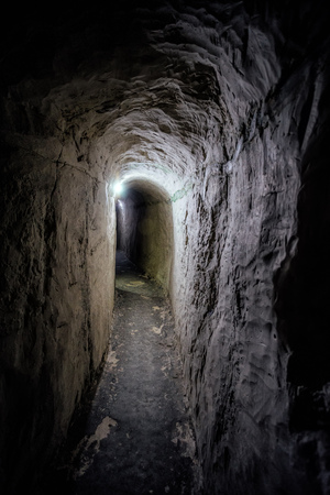 Dark underground passage of old chalky cave monastery.の写真素材
