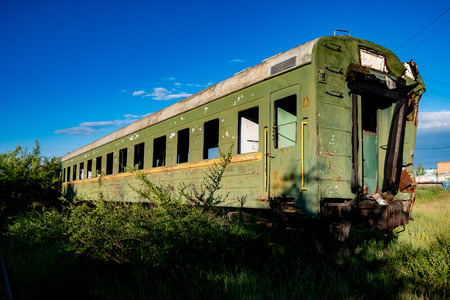 Abandoned train. Forgotten overgrown railway. Old rusty railway carriage.の写真素材