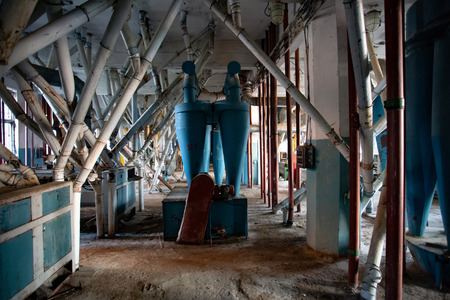 Abandoned flour milling factory. Old rusty pipeline and other equipment.の写真素材