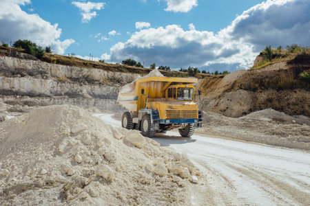 Chalk quarry. Moving dump truck loaded with chalk.