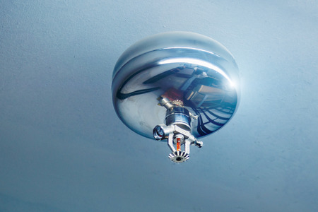 Fire sprinkler nozzle on ceiling. Automatic fast response fire protection systemの写真素材