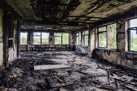 Burned interiors after fire in industrial or office building. War consequences concept.の写真素材