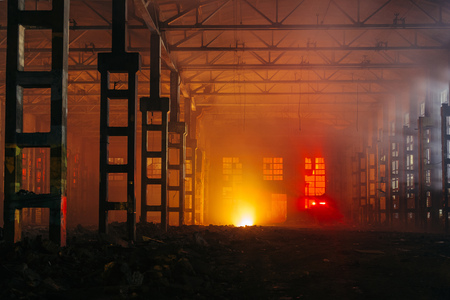 Fire in the factory. Burning industrial building interior.の写真素材