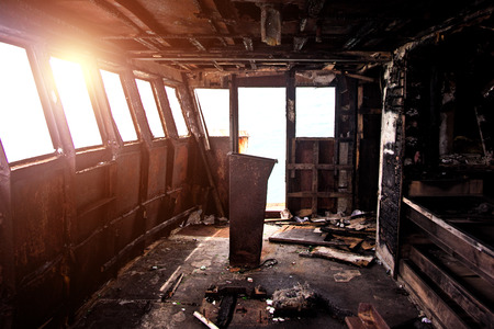 Burnt interior of ship cabin after fireの写真素材