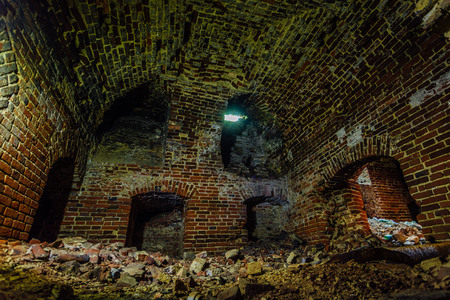Dark and creepy dirty abandoned underground basement.の写真素材